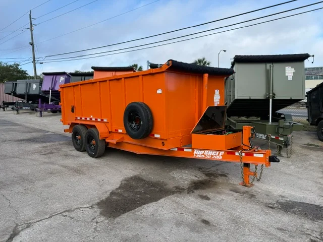 Orange enclosed dual-axle hauling trailer with rear door and safety striping