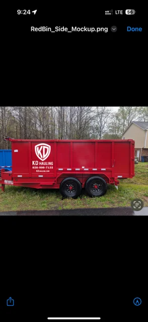 Red enclosed dual-axle hauling trailer with custom company branding and logo