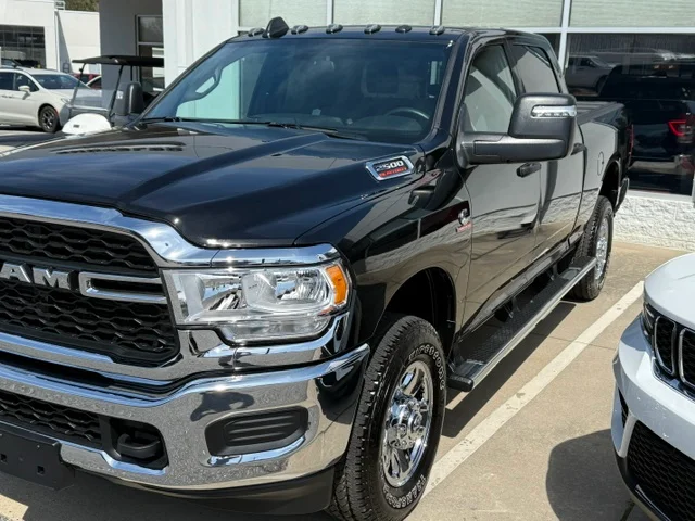 Black RAM pickup truck with polished chrome grille and trim, detailed exterior finish