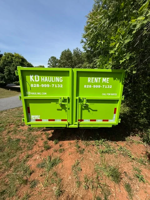 Lime-green dual-bin hauling trailer with custom vinyl wrap and company branding