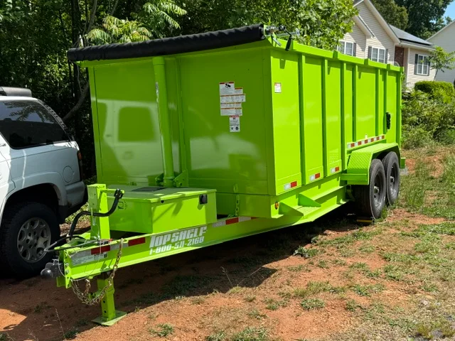 Lime-green enclosed dual-axle hauling trailer with steel frame and rear door access