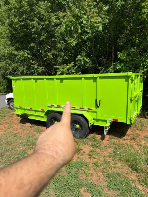 Lime-green hauling trailer with reflective safety stripes and custom wrap finish